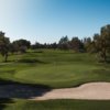 A view of a hole with cart paths on each side at Santa Anita Golf Course.