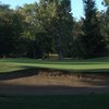 A view of a green protected by bunkers at William Land Park Golf Course.