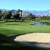 A view of a green guarded by bunkers at Rancho Mirage Country Club
