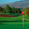 A view of a green from Chula Vista Golf Course with a bridge in background.