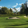A view of a green protected by bunkers at Redlands Country Club