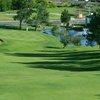 A view of a green with a bunker on the left at Indian Hills Golf Club .