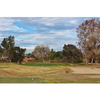 The green grass surrounding the second green shows off the new overseeding practices at Carlton Oaks Golf Club in Santee, California.